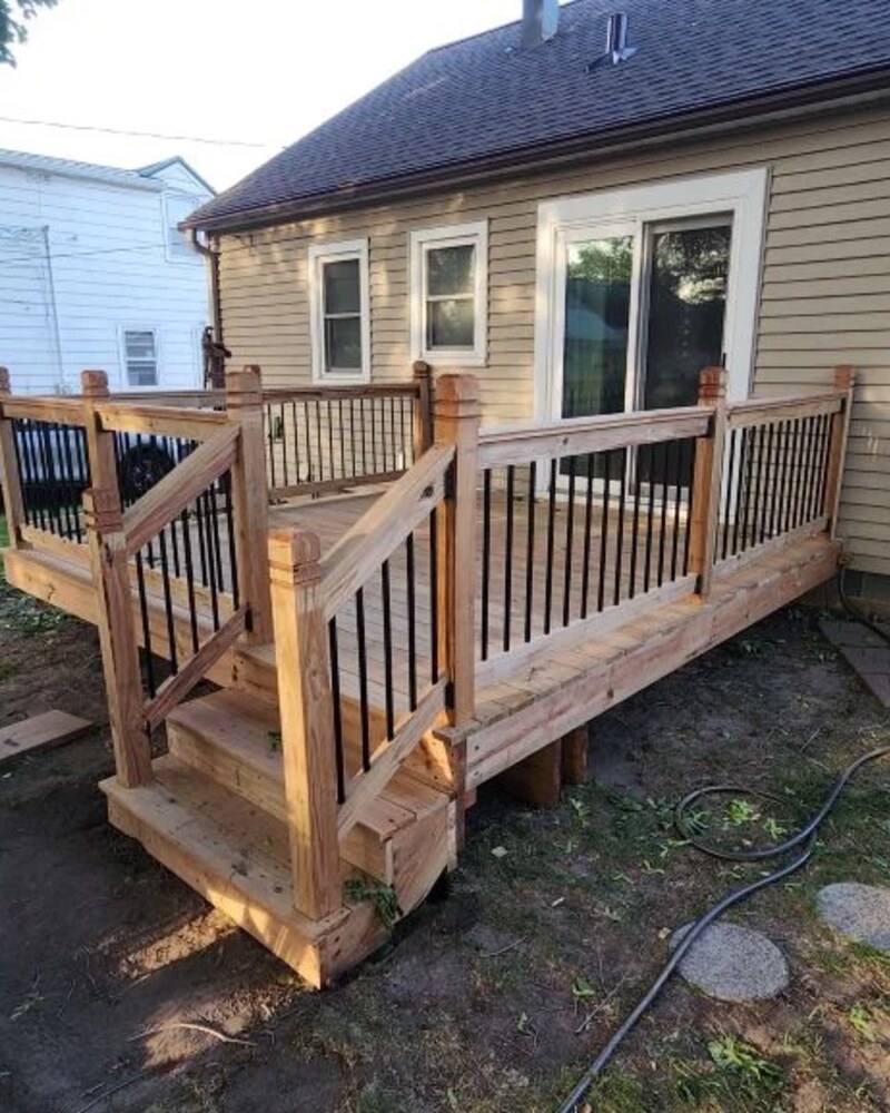 Custom cedar deck with black metal balusters